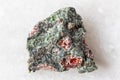 sample of pyrope garnets in raw rock on white Royalty Free Stock Photo