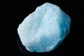 sample of raw blue aragonite rock on black granite Royalty Free Stock Photo