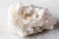 sample of raw druse of clear quartz rock on white Royalty Free Stock Photo