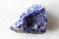 sample of raw sodalite mineral on white marble Royalty Free Stock Photo