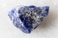 sample of raw sodalite rock on white marble Royalty Free Stock Photo