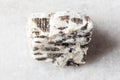 sample of raw written granite rock on white marble Royalty Free Stock Photo