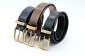 Sample of several colors, black, brown, leather men`s belt with metal shiny buckle handmade Royalty Free Stock Photo