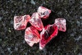 sample of several raw pyrope crystals on black Royalty Free Stock Photo