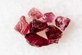 sample of several raw pyrope crystals on white Royalty Free Stock Photo