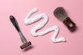 Sample of shaving foam, brush and razor on pink background, flat lay Royalty Free Stock Photo