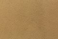 Sample of a texture of brown plaster. Wall finished with a decorative cement stucco. Example of exterior building decoration. Royalty Free Stock Photo