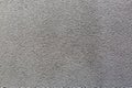 Sample of a texture of gray plaster. Wall finished with a decorative cement stucco. Example of exterior building decoration. Clean Royalty Free Stock Photo