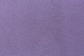 Sample of a texture of violet plaster. Wall finished with a decorative cement stucco. Example of exterior building decoration. Royalty Free Stock Photo