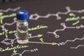 Sample vial on black paper with chemical formula Royalty Free Stock Photo