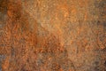 Sample of worn by time fiberboard with shabby, dirty, and cracked paint and relief texture. Grunge background in brown