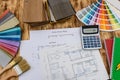 Samplers for decorating and house plan on desk Royalty Free Stock Photo