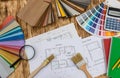 Samplers for decorating and house plan on desk Royalty Free Stock Photo