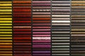 Samples of carpets of different colors on a stand in a store or production. Multi-colored carpet samples on the floor Royalty Free Stock Photo