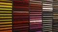 Samples of carpets of different colors on a stand in a store or production. Multi-colored carpet samples on the floor Royalty Free Stock Photo