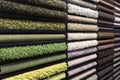 Samples of carpets of different colors on a stand in a store or production. Multi-colored carpet samples on the floor Royalty Free Stock Photo