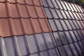 Samples of ceramic roofing tiles in a warehouse of a roofing mat