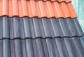 Samples of ceramic roofing tiles in a warehouse of a roofing mat