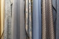 Samples of curtains in the salon. Modern trends in decor and interior design. Close-up Royalty Free Stock Photo