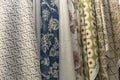 Samples of curtains in the salon. Modern trends in decor and interior design. Close-up. Selective focus Royalty Free Stock Photo