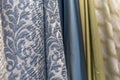 Samples of curtains in the salon. Modern trends in decor and interior design. Close-up. Selective focus Royalty Free Stock Photo