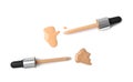 Samples of different foundation  and droppers on white background, top view Royalty Free Stock Photo