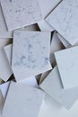 Samples of different stones mainly white based with marble like grains and veins Royalty Free Stock Photo