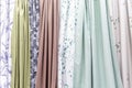 Samples of fabrics for curtains in the salon. Modern trends in decorating and interior design. Close-up Royalty Free Stock Photo