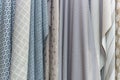 Samples of fabrics for curtains in the salon. Modern trends in decorating and interior design. Close-up Royalty Free Stock Photo