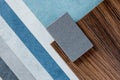 samples of finishing materials, close-up view, including various wooden laminates, interior wallpaper, gray artificial stone Royalty Free Stock Photo