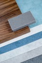 samples of finishing materials, close-up view, including various wooden laminates, interior wallpaper, gray artificial stone Royalty Free Stock Photo