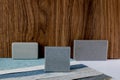 samples of finishing materials, close-up view, including various wooden laminates, interior wallpaper, gray artificial stone Royalty Free Stock Photo