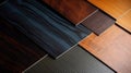 Samples of laminate and vinyl floor tile on black wooden background. Top view Royalty Free Stock Photo