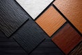 Samples of laminate and vinyl floor tile on black wooden background. Top view Royalty Free Stock Photo