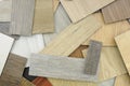 Samples of laminate and vinyl floor tile on wooden Backgroun Royalty Free Stock Photo