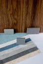 Samples of materials for interior design. Fabric wallpaper, samples of artificial stone, wood