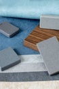 Samples of materials for interior design. Fabric wallpaper, samples of artificial stone, wood