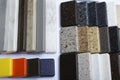 Samples of natural granite, marble and quartz stone, countertops. Model from stones, close-up. Modern colored slabs made of Royalty Free Stock Photo