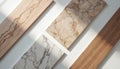 Samples of natural marble and wood materials for interior design. Different textures and colors displayed on white surface with Royalty Free Stock Photo