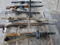 Samples of Soviet automatic weapons of the second world war. Machine guns and machine guns on a wooden table outside on a summer d Royalty Free Stock Photo