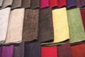 Samples of textiles for upholstery. Closeup details of multicolor fabric texture samples. Samples of different colors Royalty Free Stock Photo