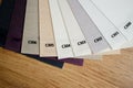 Samples of textured fabrics of different colors for the manufacture of fabric blinds for sun protection. Palette to