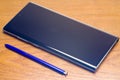 Samsung Galaxy Note 10 on the desk Royalty Free Stock Photo