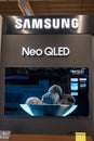 Samsung Logo and TV Neo Qled inside electronics store. Minsk, Belarus, 2023