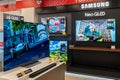 Samsung QLED TVs display inside electronics store. Minsk, Belarus - January 10, 2024