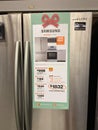 A Samsung stainless steel french door refrigerator on sale at a Home Depot Store