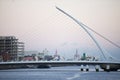 The Samuel Beckett Bridge crosses the Liffey River.