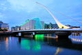 Samuel Beckett Bridge and modern buildings at night, Dublin, Ireland Royalty Free Stock Photo