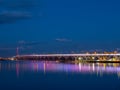 The Samuel De Champlain Bridge linking Montreal with the south shore is illuminated in rainbow colors on the Saint Lawrence River