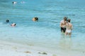 SAMUI ISLAND, THAILAND - OCTOBER 13, 2019 : Unidentified tourists prepare to wear snorkeling glasses to see coral under the sea on